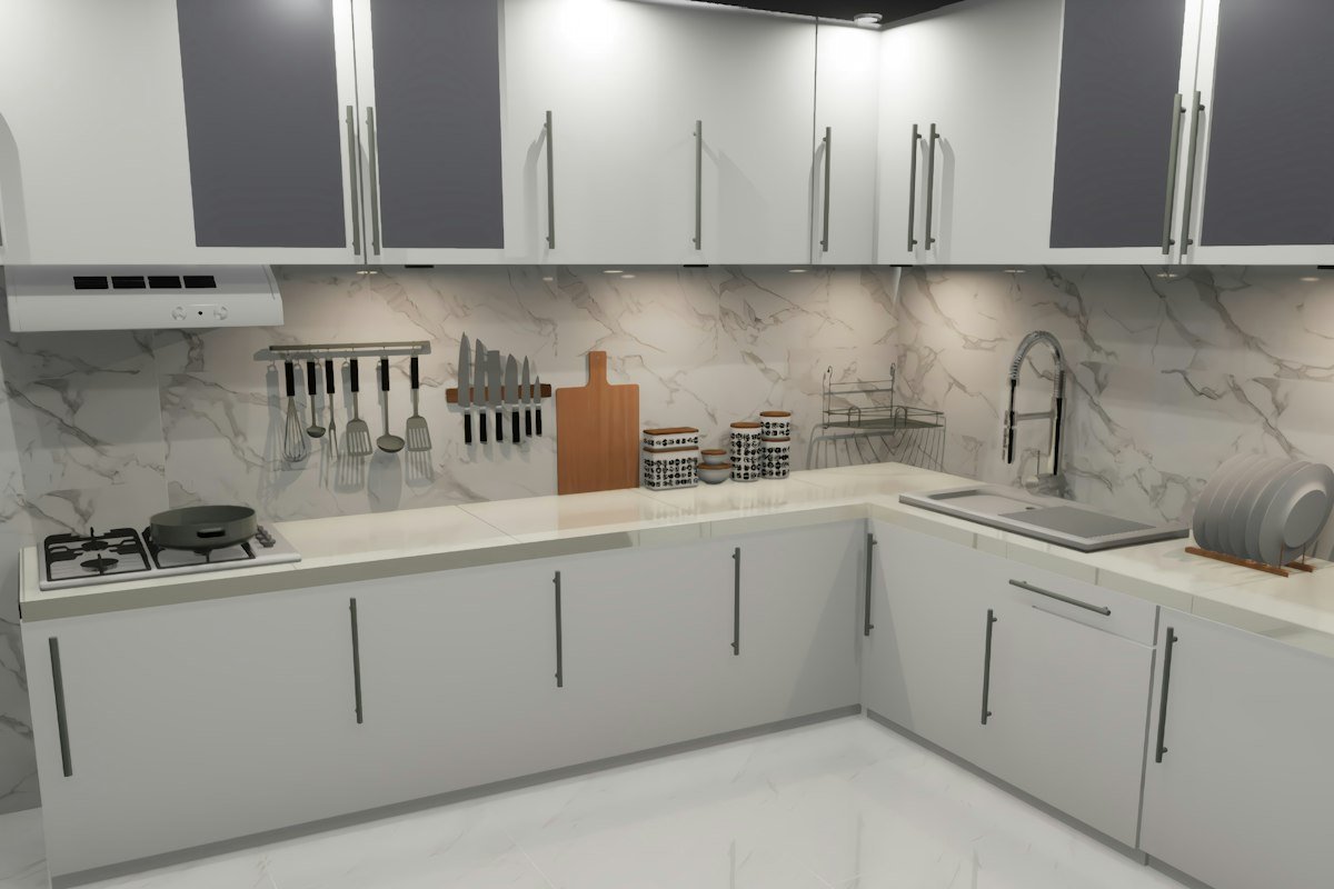 Cocina en L con muebles bajos grises y encimera de piedra